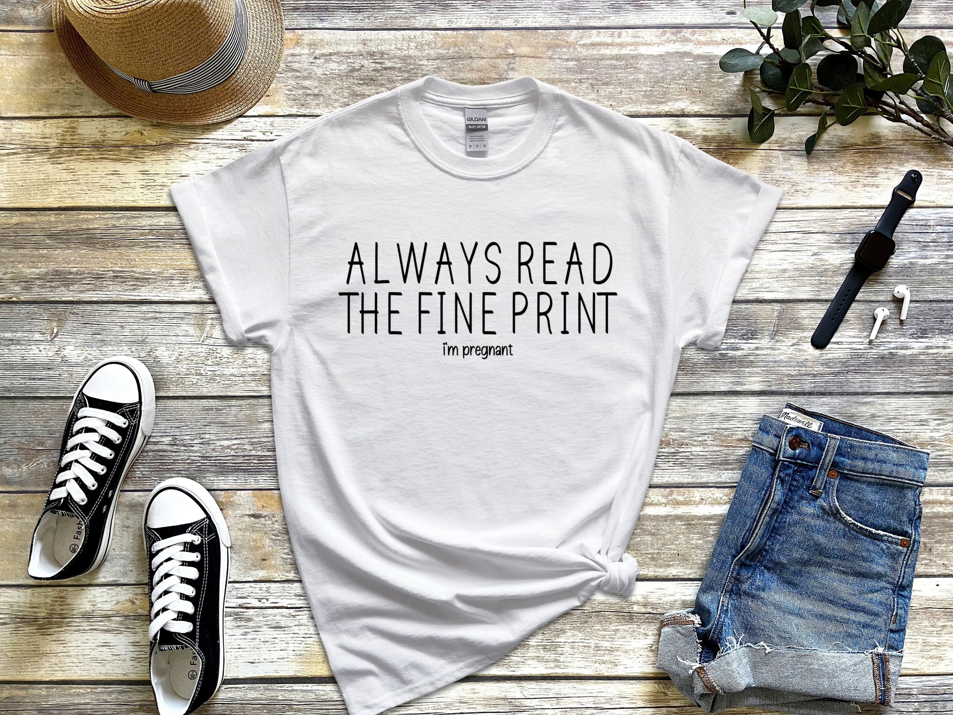 White short sleeved adult t-shir that says "ALWAYS READ THE FINE PRINT" and below it, in a smaller font, it says i'm pregnant