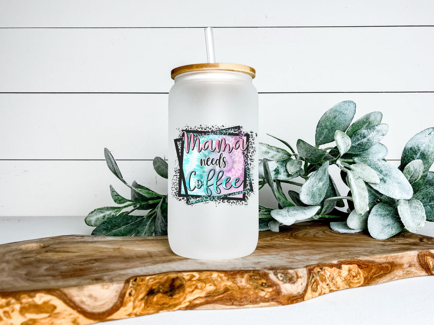 frosted glass tumbler with bamboo lid. it says MAMA NEEDS COFFEE with tie die and cheetah print.