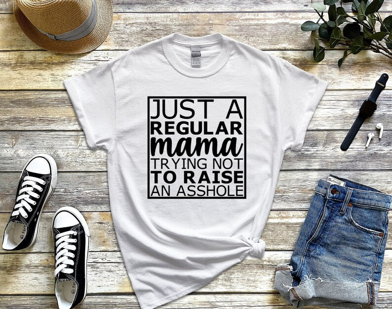 Just a regular mama trying not to raise an asshole t-shirt - Designs by Tangsley