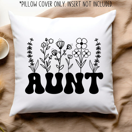 White pillow with black design. "AUNT" with flowers growing from it.