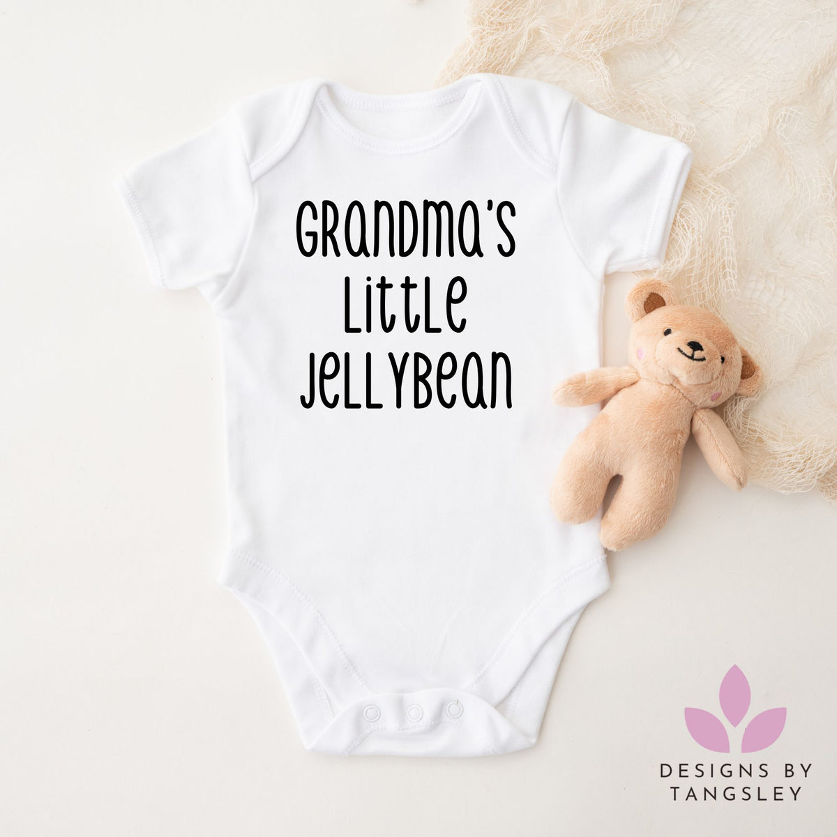 White shortsleeved bodysuit that says grandmas little jellybean in black font.