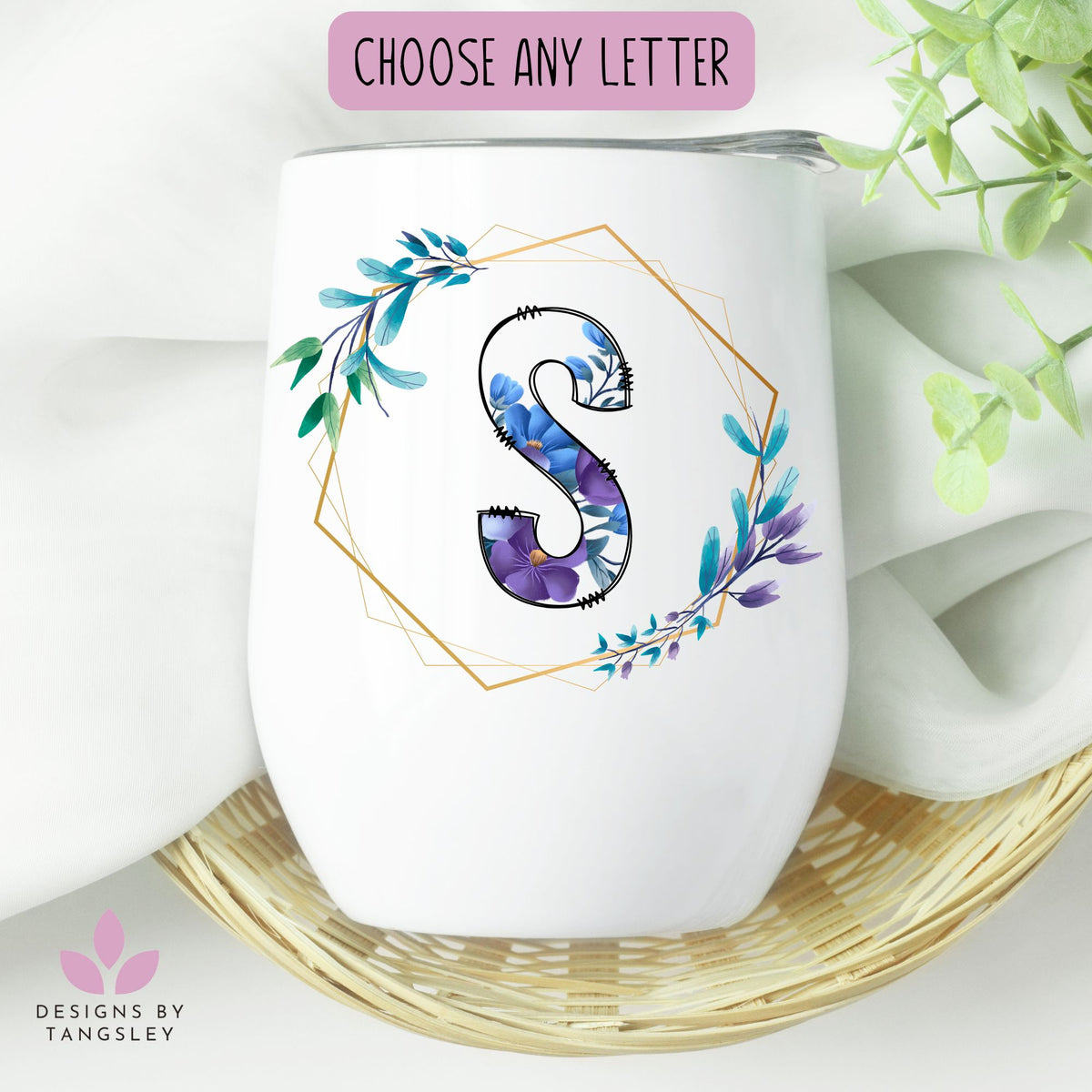 White wine tumbler with lid. There's a gold monogram with a purple and blue floral lettering and leaves for personalization. Handmade in Cape Breton