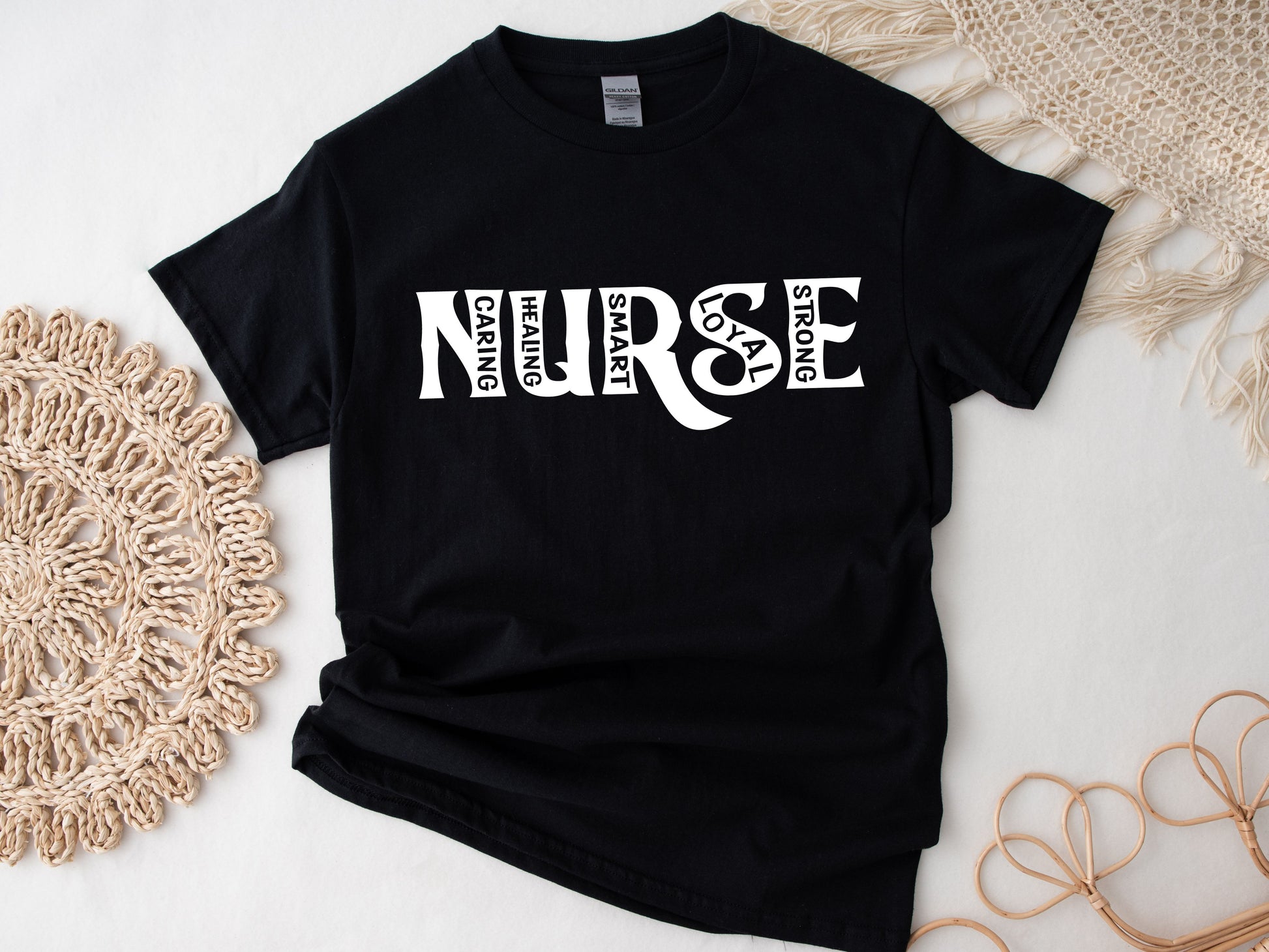 black shirt that says NURSE shirt with kind words inside the letters. "Caring, healing, smart, loyal, strong"